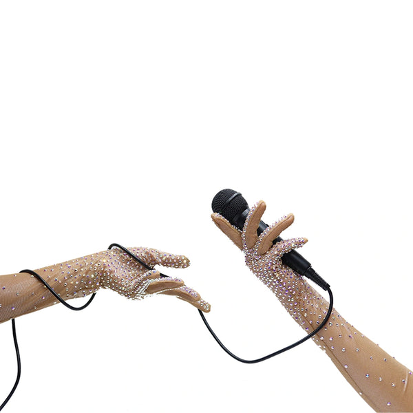 opera length bejeweled mocha silver metallic foil mesh luxury gloves holding a microphone