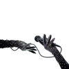 opera length bejeweled black velour luxury gloves holding a microphone