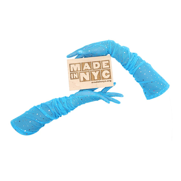 blue mesh gloves with multicolor glittery dots holding wooden Made in NYC sign