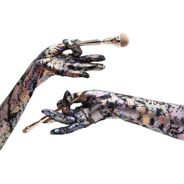 opera length colorful oil spill print spandex gloves holding makeup brushes