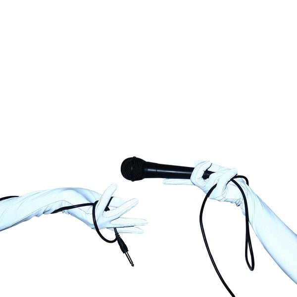 opera length silver reflective vinyl gloves with flash on holding aux cord in left hand and microphone in right hand