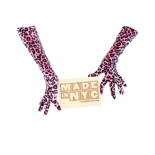 opera length velour pink leopard print gloves holding wooden Made in NYC sign