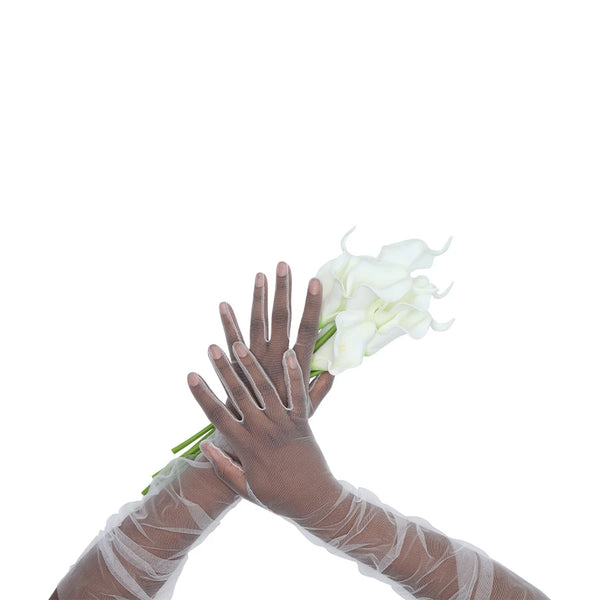 Opera length sheer tulle white gloves holding a white calla lily bouquet