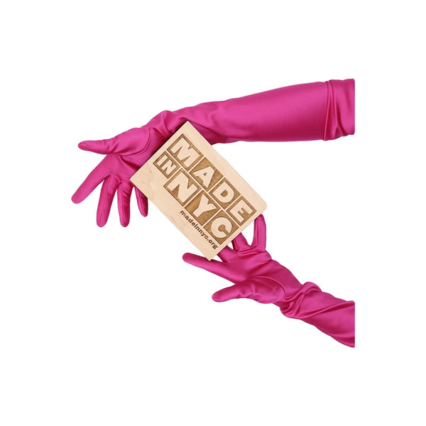 opera length Italian satin fuchsia gloves holding wooden Made in NYC sign