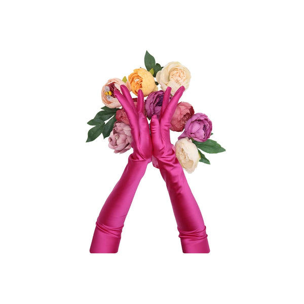 opera length Italian satin fuchsia gloves posed over a floral arrangement