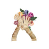 opera length Italian satin gold gloves resting over a flower arrangement