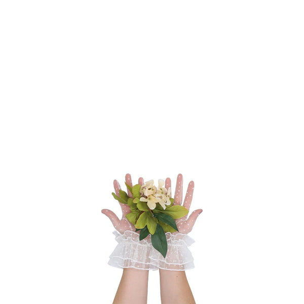 wrist length puffy white tulle gloves with accent white polka dots holding flowers