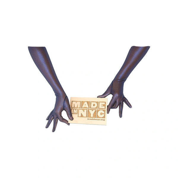 opera length metallic mesh black and royal blue gloves holding wooden Made in NYC sign