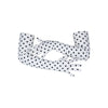 arms crossed wearing long white gloves with small black polka dots