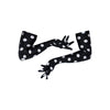 long black gloves with large white polka dots posed with scooped arms