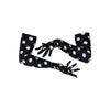 long black gloves with large white polka dots posed with crossed arms