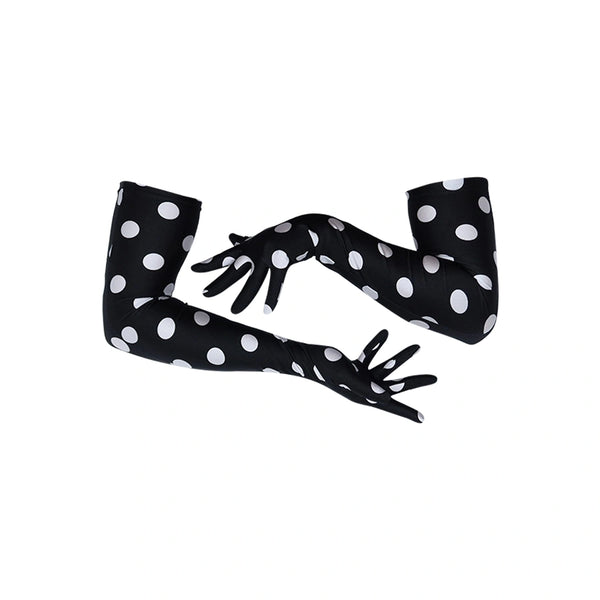 long black gloves with large white polka dots posed with crossed arms