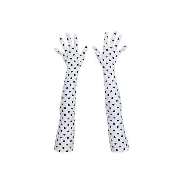 top view of long white gloves with small black polka dots