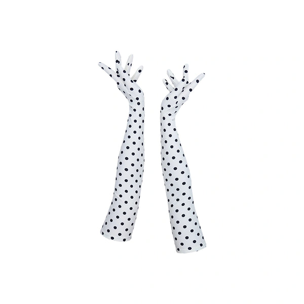 full view of long white gloves with small black polka dots