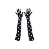 top view of long black gloves with large white polka dots
