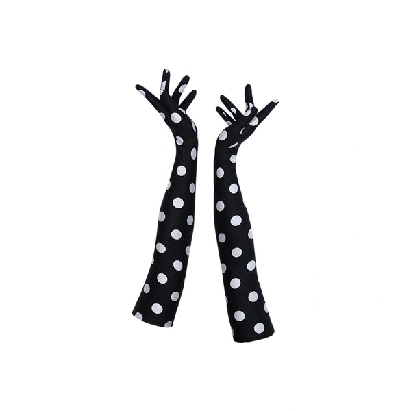 full view of long black gloves with large white polka dots
