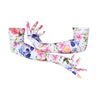 arms crossed wearing long white gloves with floral skull pattern