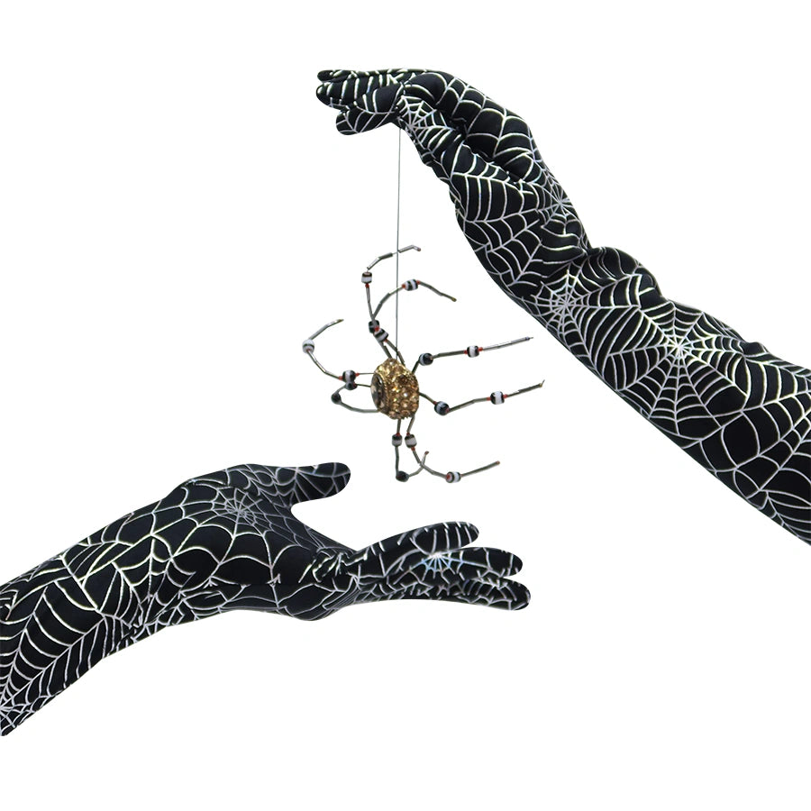 image of Long spiderweb print gloves holding a beaded spider trinket