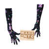 opera length black gloves with purple floral pattern holding wooden Made in NYC sign