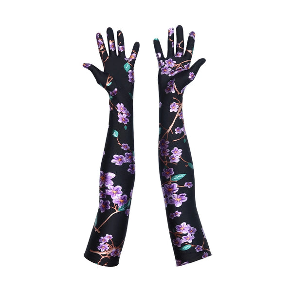 opera length black gloves with purple floral pattern and palms facing up