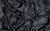 black satin fabric that is used by Wing + Weft Gloves