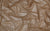 tan shimmering holo dot fabric, used for handcrafted luxury gloves