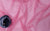 pink mesh fabric with a flower on top
