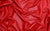 close up of red faux stretch leather