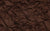 Close-up fabric swatch of chocolate brown 4-way stretch spandex, used for glove making
