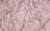 rose colored spandex fabric swatch, used for luxury glove making