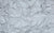Swatch of silver stretch spandex fabric, designed for handmade gloves in NYC