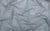 Fabric swatch of grey color mesh with silver holographic dots