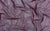 Fabric swatch of purple color mesh with holographic dots