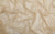 Fabric swatch of nude color mesh with gold holographic dots