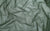 Swatch of olive green holo dot stretch mesh fabric