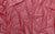 Vibrant red holo dot mesh fabric swatch, used for handmade Michelle gloves
