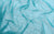 Fabric swatch of turquoise 2-way stretch holo dot mesh, used for the handmade Michelle gloves
