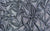 Close up of mini-dot spandex in a silvery black color