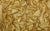 Close-up of Natasha gloves' fabric swatch in gold