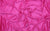 A hot pink Natasha glove fabric swatch, made from 4-way stretch holo mini-dot spandex
