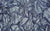 Close-up view of fabric swatch for the Natasha glove, shown in a navy silver color