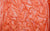detailed image of neon orange spandex fabric swatch