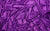 Detailed view of purple glove fabric swatch, made from 4-way stretch holo mini-dot spandex