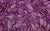 Detailed view of Natasha glove fabric swatch, made from 4-way stretch holo mini-dot spandex, in a golden purple color