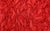 close up image of bold red 4-way stretch holo mini-dot spandex fabric swatch, used in our handmade gloves