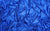 close up image of royal blue mini-dot spandex swatch