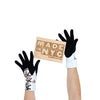 photo of model holding a made in NYC sign while wearing black gloves