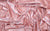 peach colored vinyl fabric, used for gloves handmade in the Garment District.