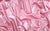 pink vinyl fabric swatch, used for high-fashion, performance-inspired gloves