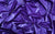 Close-up of purple vinyl fabric, used in glamorous gloves influenced by Rita Hayworth